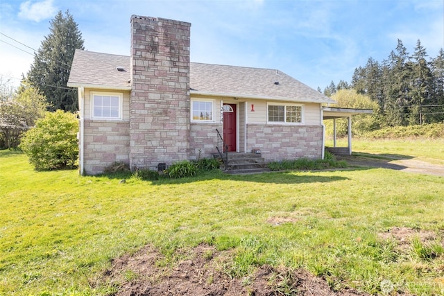 view of front of house with roof with shingles, a chimney, a front yard, and stone siding