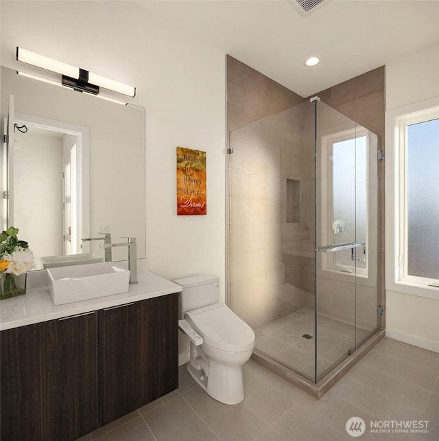 full bath with recessed lighting, tile patterned flooring, toilet, vanity, and a stall shower