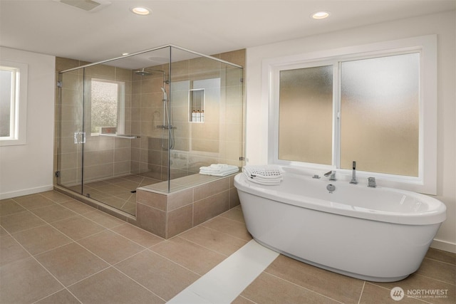 full bath with tile patterned floors, a shower stall, recessed lighting, and a soaking tub