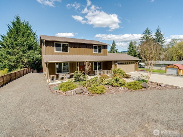 view of front of home featuring a garage, a porch, board and batten siding, and concrete driveway