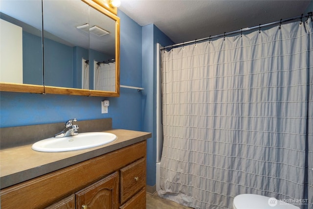 122 W Dayton Ave, Dayton, WA 99328 - full bath with vanity, toilet, and a shower with shower curtain