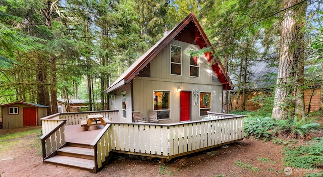 18016 Glacier Rim Dr, Glacier, WA 98244 - back of house featuring a storage unit, a wooden deck, and an outdoor structure