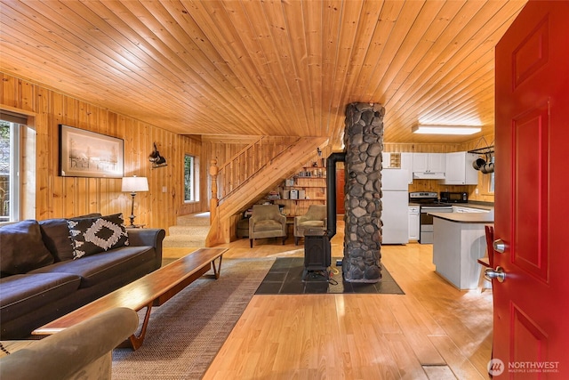 18016 Glacier Rim Dr, Glacier, WA 98244 - living area with wooden walls, stairs, light wood-style floors, and wood ceiling