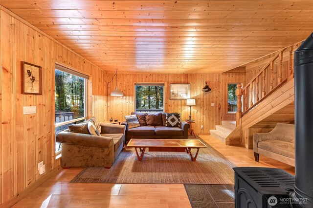 18016 Glacier Rim Dr, Glacier, WA 98244 - living area with wooden walls, a healthy amount of sunlight, and stairs