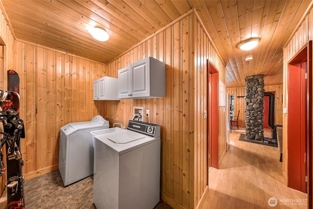 18016 Glacier Rim Dr, Glacier, WA 98244 - laundry area with wood ceiling, wooden walls, washer and dryer, and cabinet space