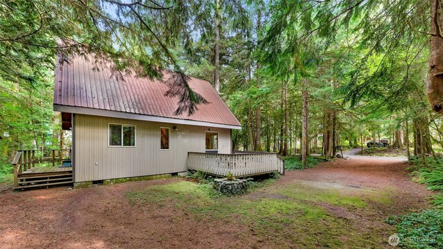 18016 Glacier Rim Dr, Glacier, WA 98244 - rear view of house featuring metal roof, a deck, and crawl space