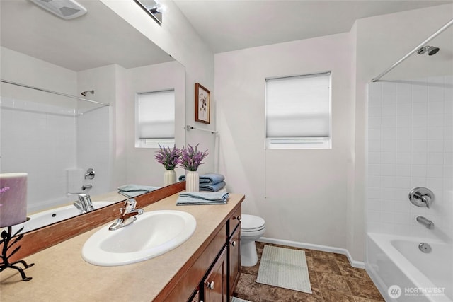 bathroom featuring toilet, visible vents, bathtub / shower combination, and vanity