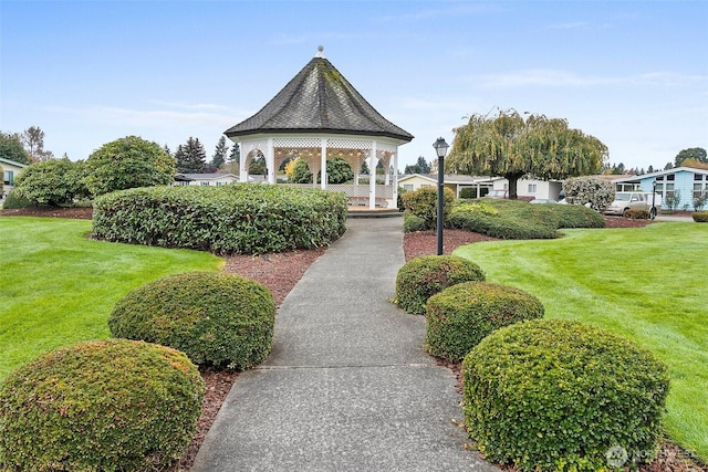 view of community featuring a gazebo and a yard
