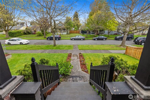view of yard with fence and a residential view