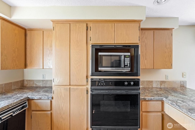 kitchen with black appliances, light countertops, and light brown cabinetry