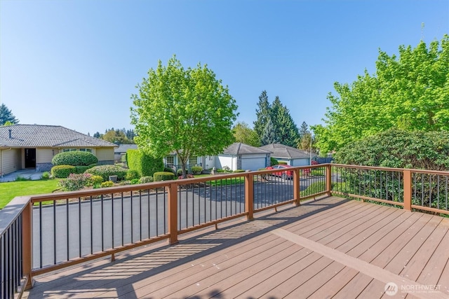 wooden deck with an outbuilding