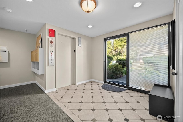 interior space featuring recessed lighting, baseboards, elevator, and light floors