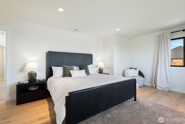 bedroom with baseboards, recessed lighting, and wood finished floors
