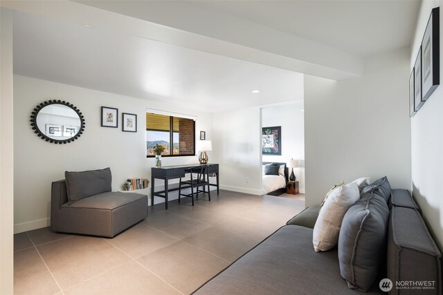 living room with baseboards, recessed lighting, and light tile patterned flooring