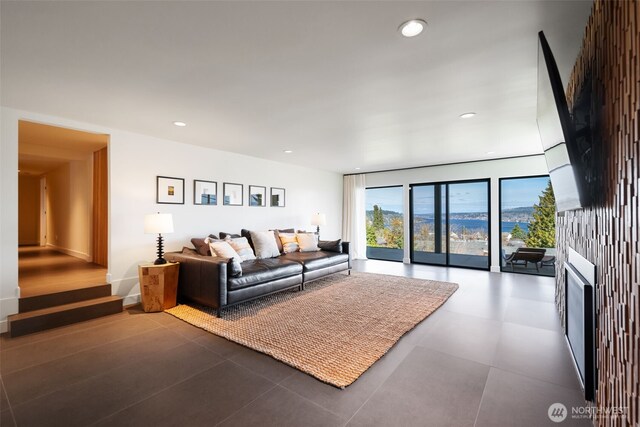 living area with a fireplace and recessed lighting