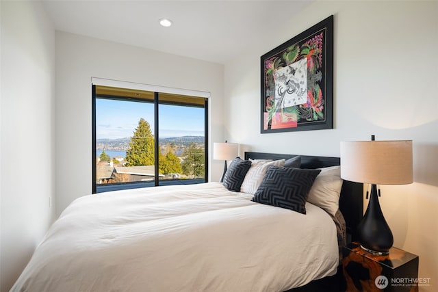 bedroom with recessed lighting and access to outside