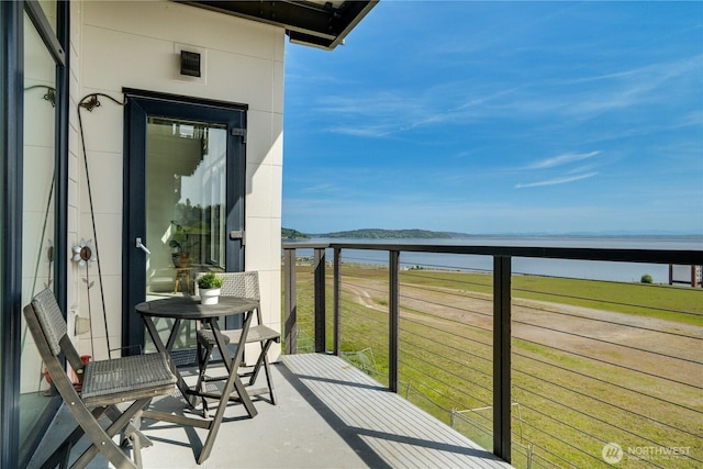 balcony featuring a water view