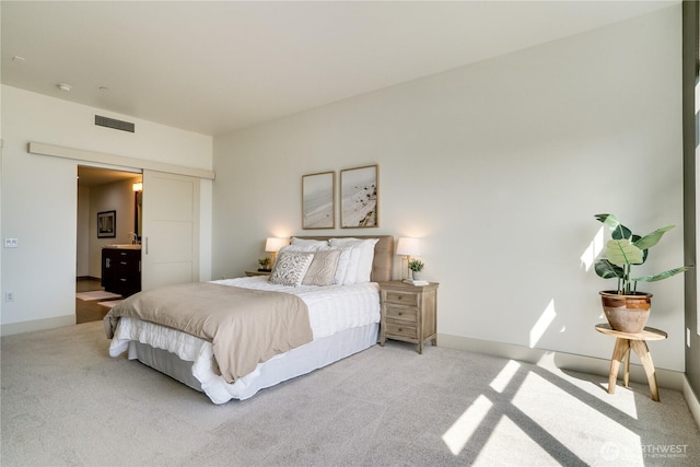 carpeted bedroom featuring baseboards and visible vents