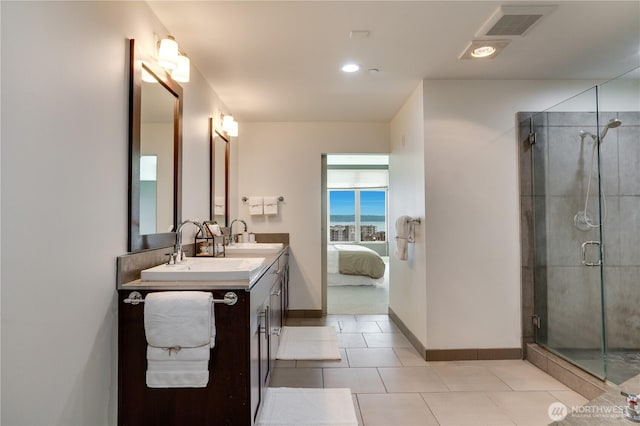 ensuite bathroom featuring visible vents, double vanity, ensuite bathroom, tile patterned floors, and a stall shower