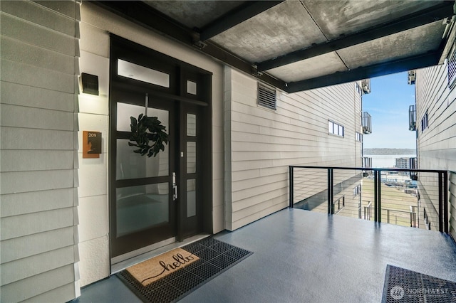 doorway to property featuring a balcony