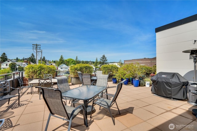 view of patio featuring outdoor dining area and a grill