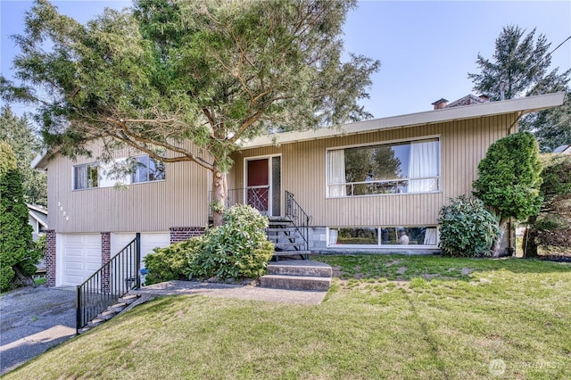 3828 Harbel Dr NE, Bremerton, WA 98310 - view of front facade with a front yard, aphalt driveway, and a garage