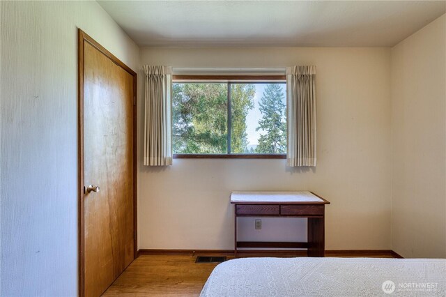 3828 Harbel Dr NE, Bremerton, WA 98310 - bedroom featuring baseboards, visible vents, and wood finished floors