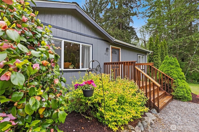 view of exterior entry with a deck
