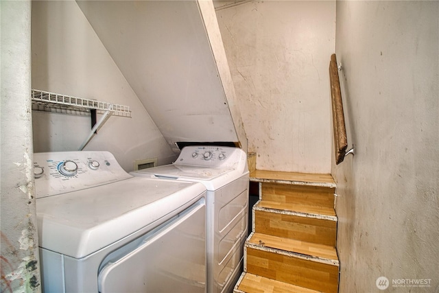 washroom featuring laundry area and separate washer and dryer