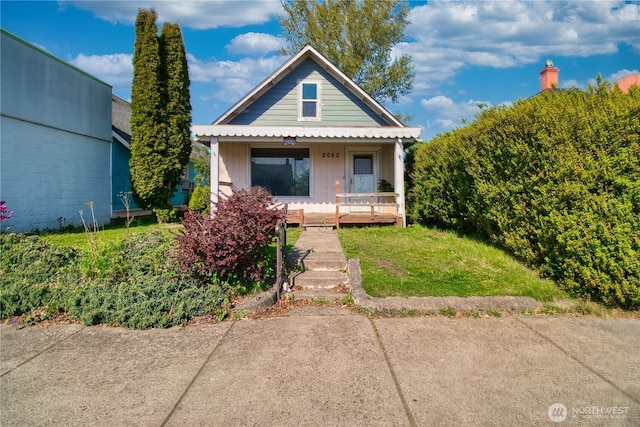 bungalow-style home featuring board and batten siding and a porch