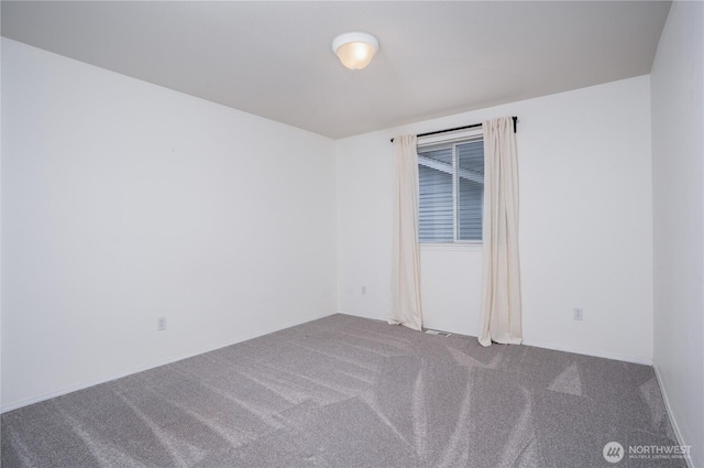 spare room featuring carpet