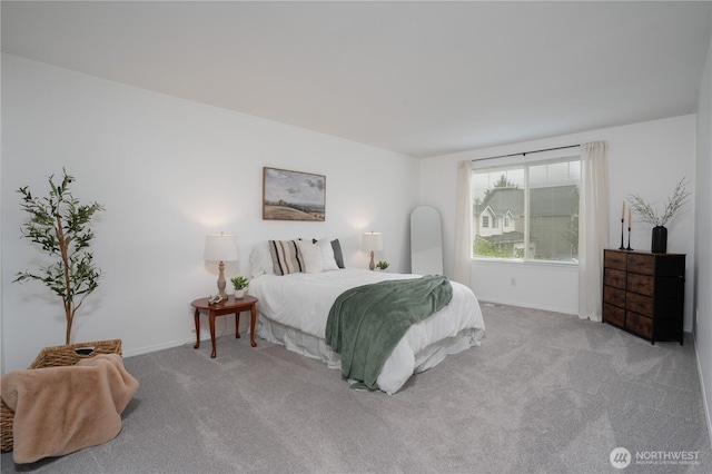 carpeted bedroom with baseboards