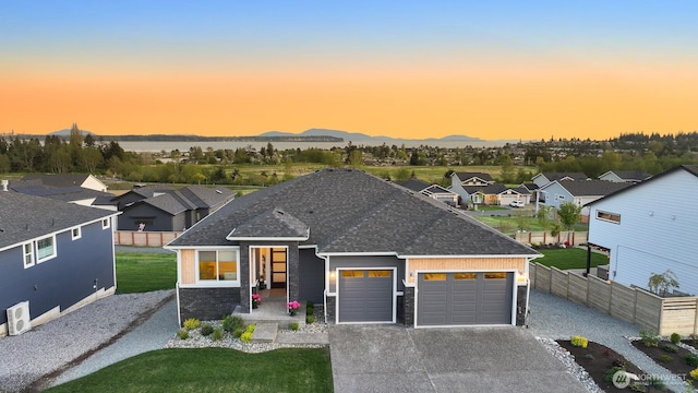 5423 Lonicera Dr, Blaine, WA 98230 - view of front of home featuring roof with shingles, a garage, a residential view, driveway, and stone siding