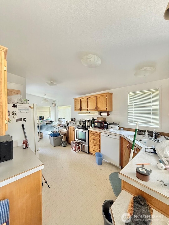 84 Weatherstone Rd, Omak, WA 98841 - kitchen featuring white appliances, light countertops, and a sink