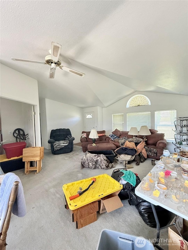 84 Weatherstone Rd, Omak, WA 98841 - carpeted living area with vaulted ceiling, a textured ceiling, and a ceiling fan