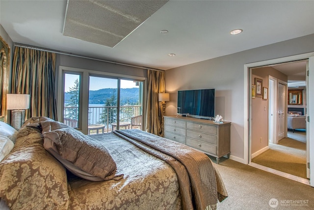 bedroom featuring access to exterior, light carpet, baseboards, and recessed lighting