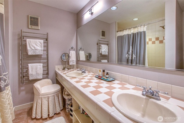 full bath with a sink, visible vents, and recessed lighting