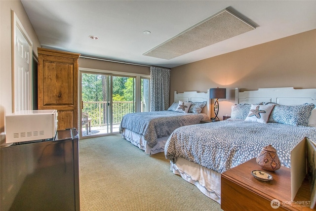bedroom featuring carpet and access to outside