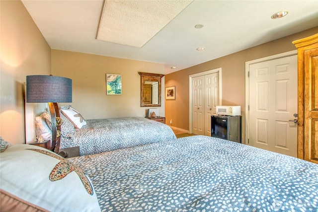 bedroom featuring a closet and recessed lighting