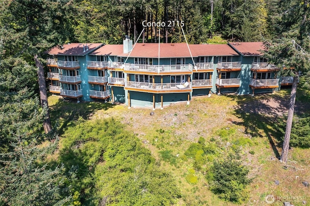 view from above of property featuring a heavily wooded area