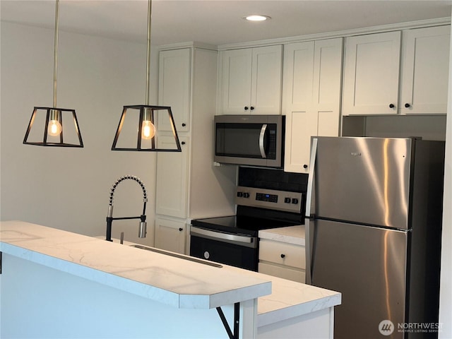 kitchen with pendant lighting, white cabinetry, decorative backsplash, stainless steel appliances, and recessed lighting
