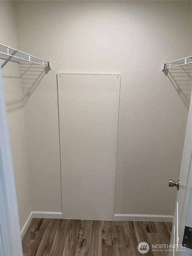 spacious closet with wood finished floors