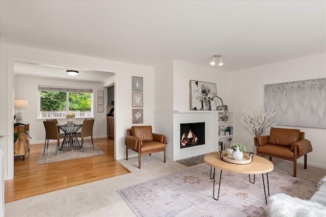 15510 NE 59th St, Redmond, WA 98052 - carpeted living area with baseboards and a fireplace