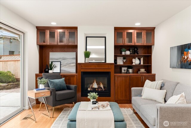 15510 NE 59th St, Redmond, WA 98052 - living area featuring recessed lighting, a glass covered fireplace, and light wood finished floors