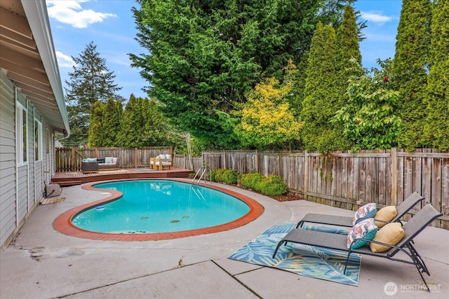15510 NE 59th St, Redmond, WA 98052 - view of pool featuring outdoor lounge area, a fenced backyard, a patio, a fenced in pool, and a wooden deck
