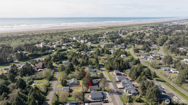 birds eye view of property with a residential view and a water view