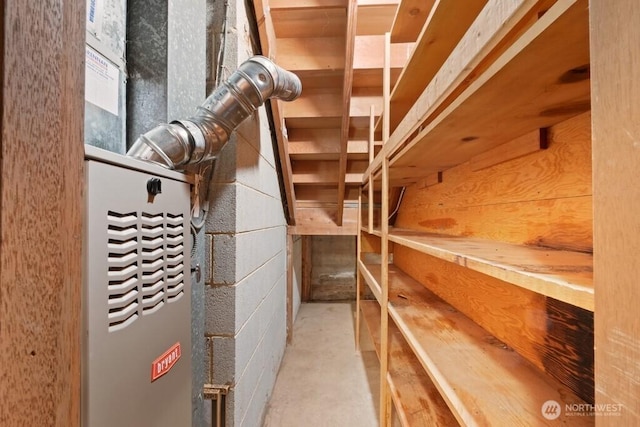 storage room featuring heating unit