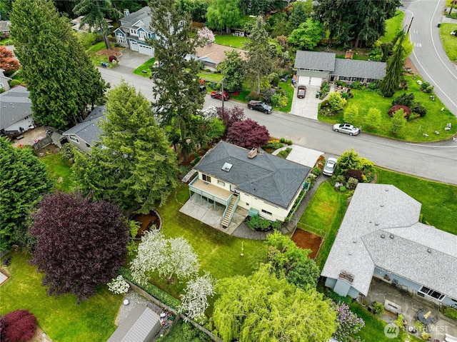 birds eye view of property with a residential view