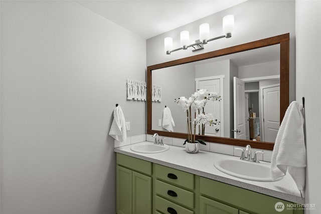 full bathroom featuring a sink and double vanity
