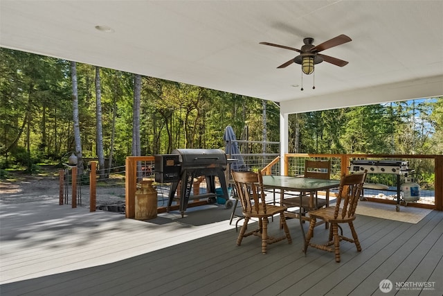 deck with area for grilling, ceiling fan, and outdoor dining space